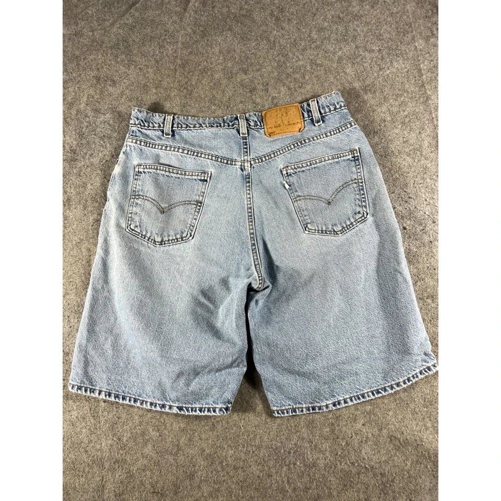 Vintage Levis 560 Loose Fit Denim Shorts Mens 36 Light Wash Blue Made in USA 90s